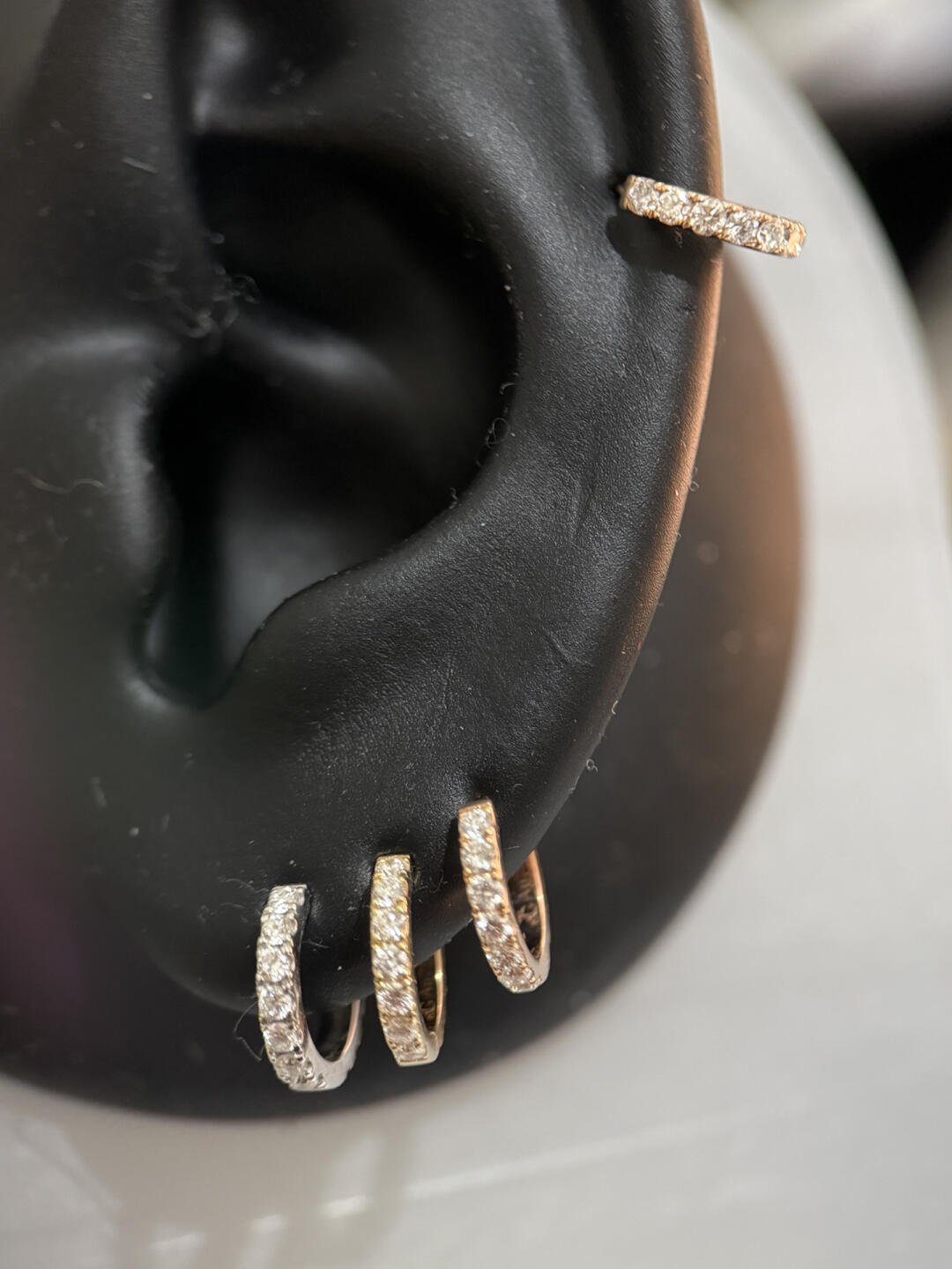 What, leaving your ear piercing empty can actually leak wealth earrings